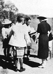 Superintendent's wife giving gifts to Lushai recruits in World War II