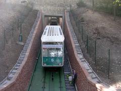 Cable car passing through the city walls at Petřín station in Prague