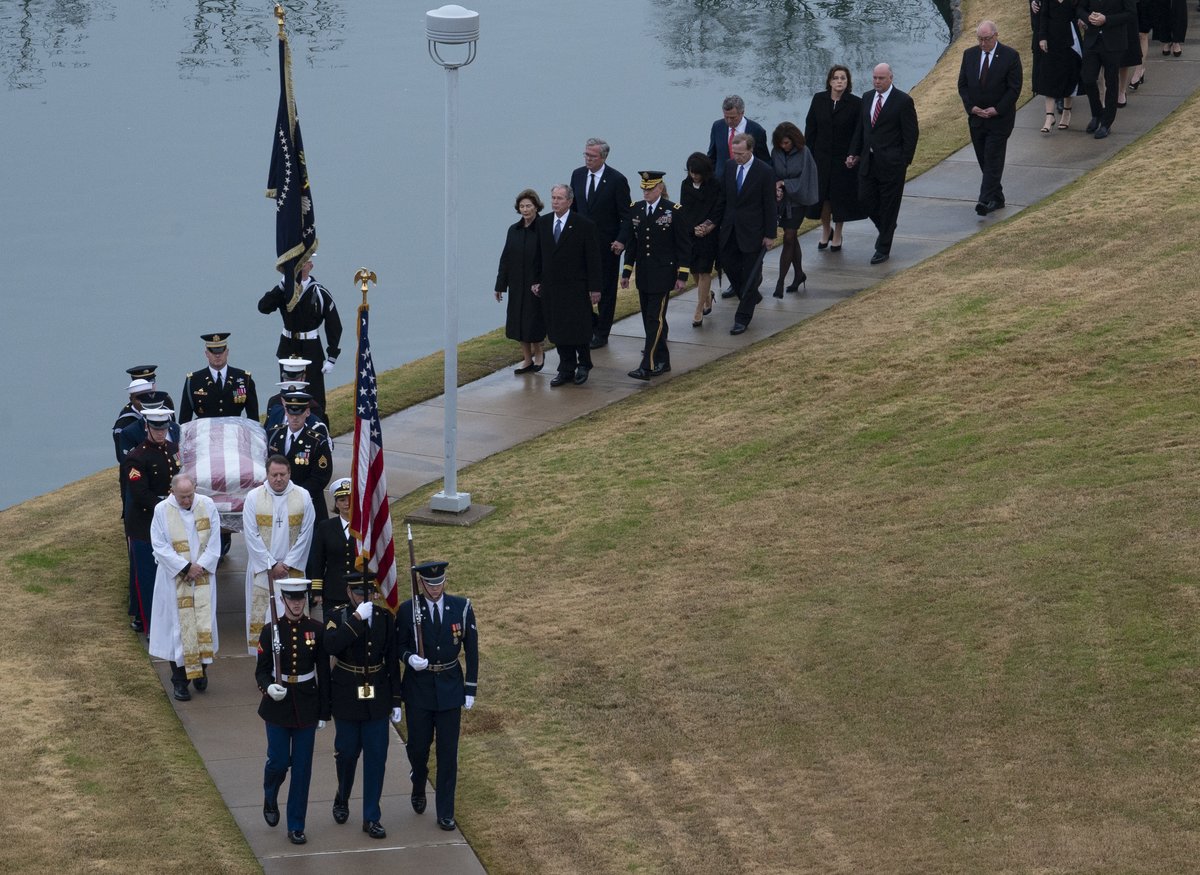 Ceremonial Honor Guard carrying former President George H.W. Bush's casket to final resting place at George Bush Presidential Library Center Texas A&M
