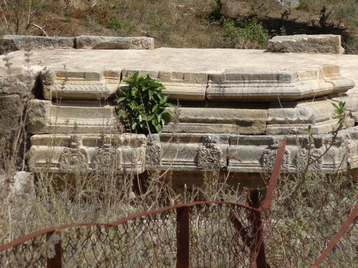 Ancient ruin in Chandragiri Fort surrounded by rocky terrain