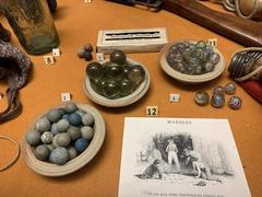 Colorful marbles displayed in glass jars at the Museum of Childhood in Edinburgh