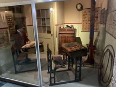 Old school classroom with wooden desks and chairs at the Museum of Childhood in Edinburgh