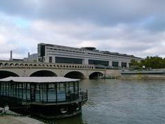 Colbert building of the French Ministry of Finance with Pont de Bercy bridge in Paris