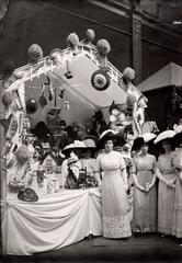 Vintage photo of a fancy fair at Pulchri Studio celebrating the 10th anniversary of the Infant Clinic in The Hague, 1912. Children playing with toys under the supervision of Mrs. Storm.
