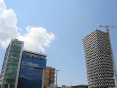 Tid Tower construction site in Tirana with cranes and scaffolding