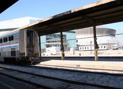 Amtrak train departing New Orleans Union Passenger Terminal with New Orleans Arena and Louisiana Superdome in the background post-Hurricane Katrina