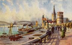 People and ships along the Rhein River with Rhein bridge in Dusseldorf