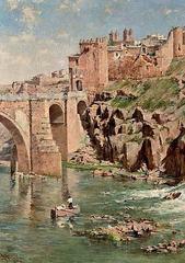 View of Toledo cityscape near Saint Martin's Bridge with historic buildings and river