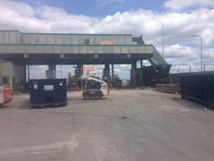 Demolition of Tobin Bridge Toll Booth on August 18, 2014 with heavy machinery and debris