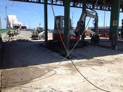 Demolition of Tobin Bridge toll booth on August 21 2014 with construction equipment