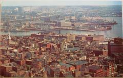 1950s aerial view of the North End and Boston Navy Yard with docks and buildings