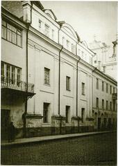 Street view of vulica Daminikanskaja in Vilnia with historic buildings and cobblestone road