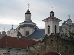 Church of the Holy Spirit in Vilnius exterior view with white walls and red roof under blue sky