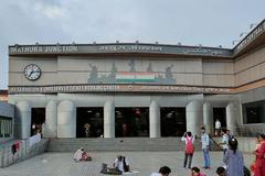 Mathura Junction railway station platform with trains and signage