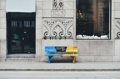Empty wooden bench on a sidewalk in Old Montreal, Canada