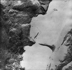 Aerial reconnaissance photograph of German battleship Tirpitz at Alten Fjord with L-shaped torpedo net during WWII