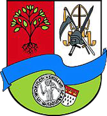 Coat of arms of Köln-Worringen with a black eagle and a gold crown on a white and gold background