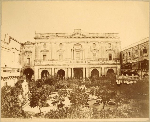 Piazza Tesoreria in Valletta during the 1860s with British-era fencing and statue of De Vilhena