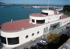 Maritime museum shaped like a ship with a red roof on the waterfront