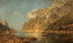 A scenic view of a Norwegian fjord with calm blue waters surrounded by steep green mountains under a partly cloudy sky
