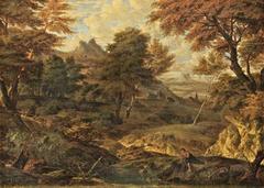 Wooded landscape with trees and a small body of water