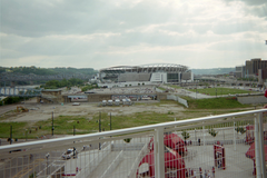 Disused stadium site of former Cinergy Field with exposed concrete and scattered debris under cloudy sky