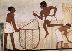 Ancient Egyptian wall painting depicting figures and hieroglyphs