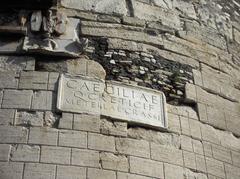 Mausoleum of Cecilia Metella on the Appian Way with dedicatory plaque and trophy relief