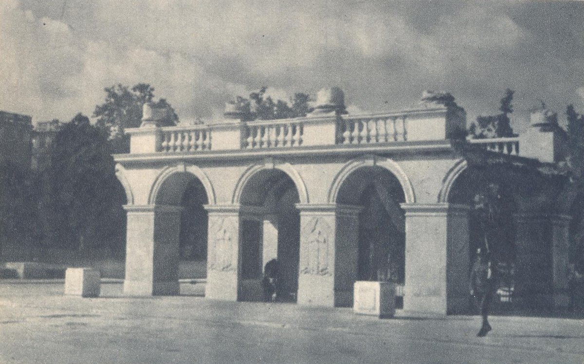 Tomb of the Unknown Soldier monument in Warsaw, Poland with eternal flame and wreaths