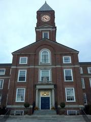 Clock tower of Upper Canada College against a blue sky with scattered clouds