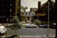 Hamilton Grange historic house tightly positioned between an apartment building and St. Luke's Church in New York City