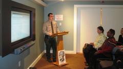 Park Ranger giving a lecture about Alexander Hamilton's youth at a lectern