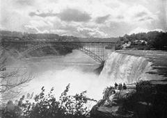 Black and white photo of Honeymoon Bridge over Niagara Falls in 1900