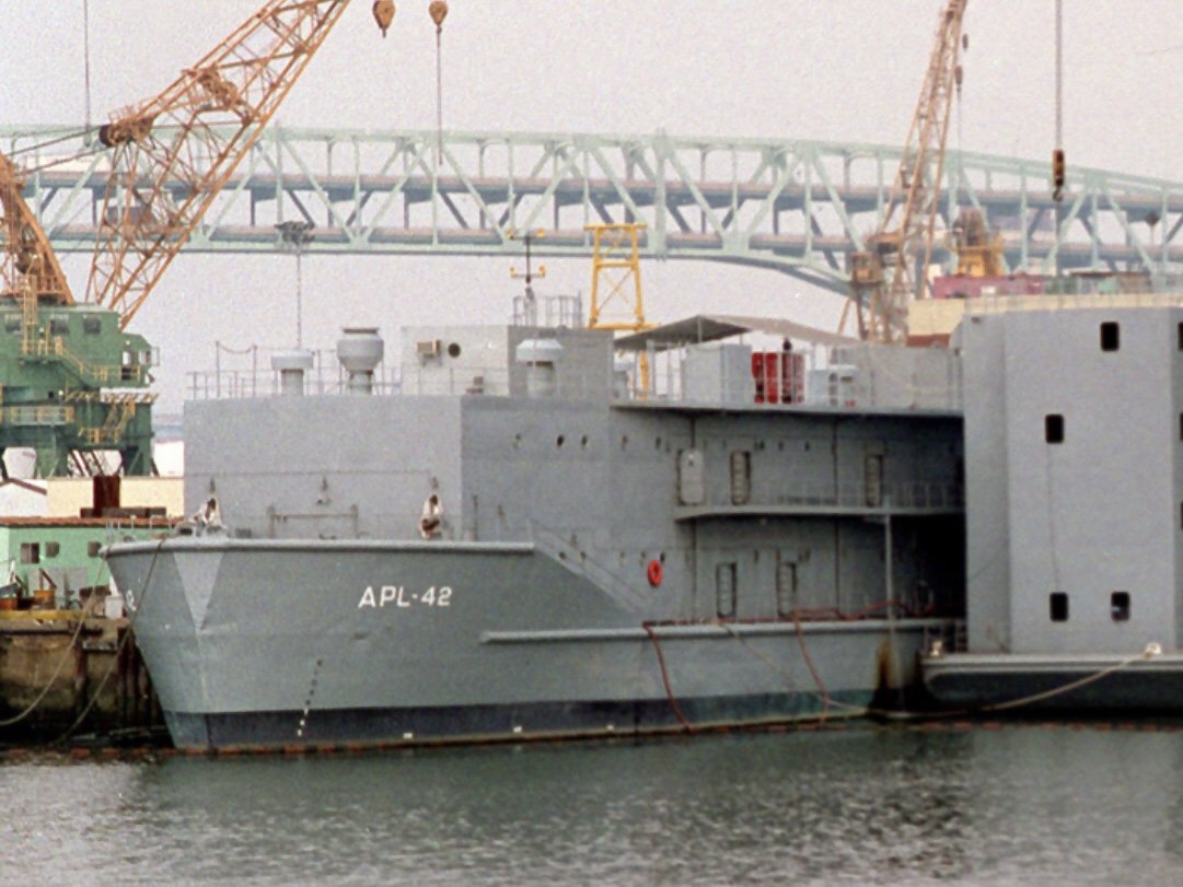 Service craft APL-42 and barracks ship moored behind USS DETROIT AOE-4 at Philadelphia Naval Shipyard in 1993