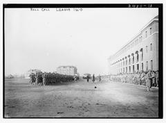 Black and white photo of a roll call at League Island with naval personnel lined up on a wooden pier