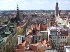 View of Wrocław Market Square from Mostek Czarownic with historic colorful buildings and lively street scene