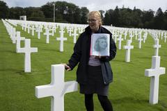 Lucy Taylor, American Battle Monuments Commission guide, telling history of 2nd Lt. Nancy J. Leo to 221st Public Affairs Detachment Soldiers at Luxembourg American Cemetery