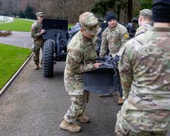 Military Police firing cannons at Luxembourg American Cemetery for Battle of the Bulge ceremony