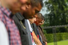 Soldiers from 1 ABCT, 1 CD praying and laying wreath at Gen. George S. Patton's grave at Luxembourg American Cemetery