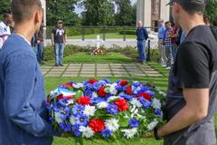 Soldiers from 1ABCT and 1CD laying wreath at General George S. Patton's gravesite in Luxembourg American Cemetery and Memorial