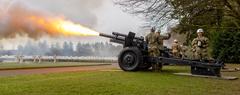 Military Police from the 529th Military Police Company firing 21-gun salute with cannons during 80th Anniversary Battle of the Bulge ceremony at Luxembourg American Cemetery