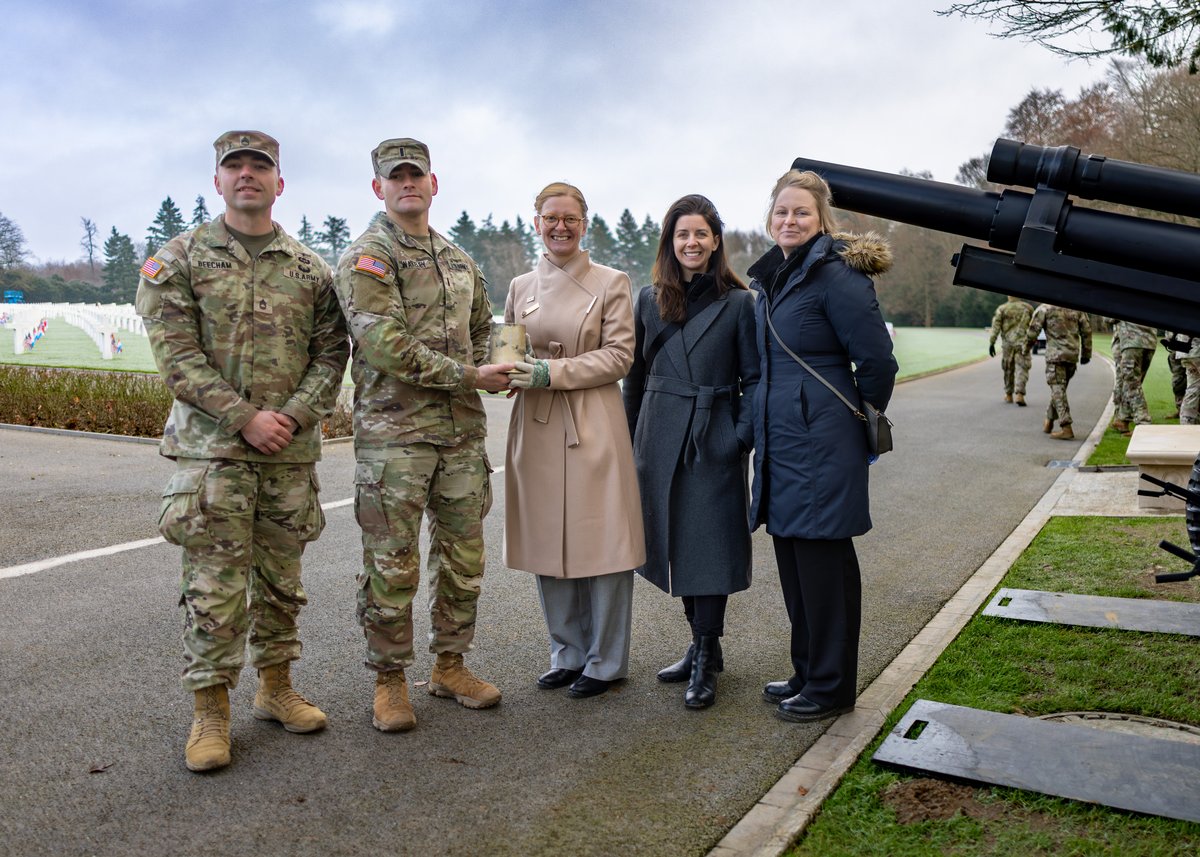 Soldiers presenting empty cartridge from 21-gun salute at 80th Battle of the Bulge Anniversary in Luxembourg