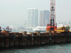 Panoramic view of Hong Kong harbor in 2005 with skyscrapers and busy waterfront
