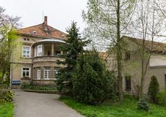Traditional mill house and three adjacent outbuildings with old courtyard paving and millstones in the courtyard at Am Mühlgraben 1 in Löbau