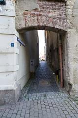 Narrow cobblestone street with traditional houses in Löbau, Germany