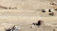 Inner wall surrounding Djedefre's Pyramid and temple with ancient Egyptian hieroglyphs