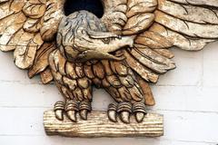 Close-up of eagle carving on the transom plate of the sailing frigate USF Constellation under restoration