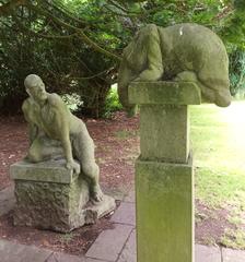 Sculpture of a figure talking to a quadruped in University College Cork grounds