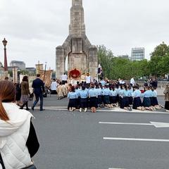Procession in Paris 2024 with people carrying banners