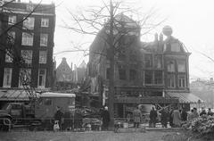 Black and white photograph of a demolished building corner at Rembrandtsplein in Amsterdam, taken on January 10, 1969